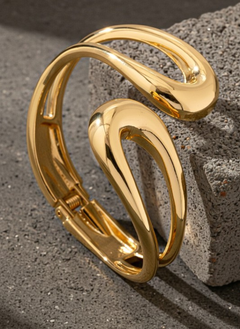Sculptural open-form gold bangle