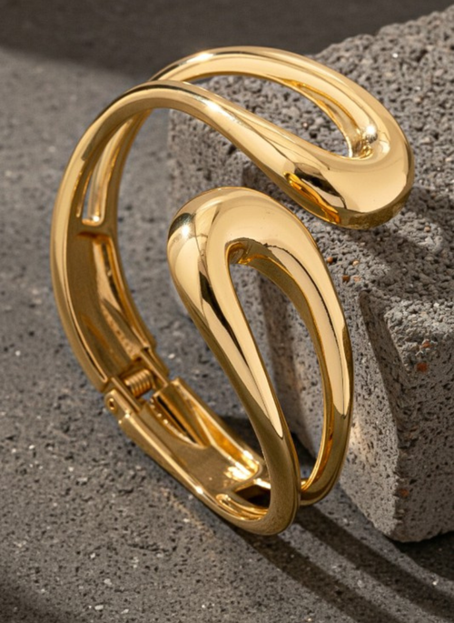 Sculptural open-form gold bangle